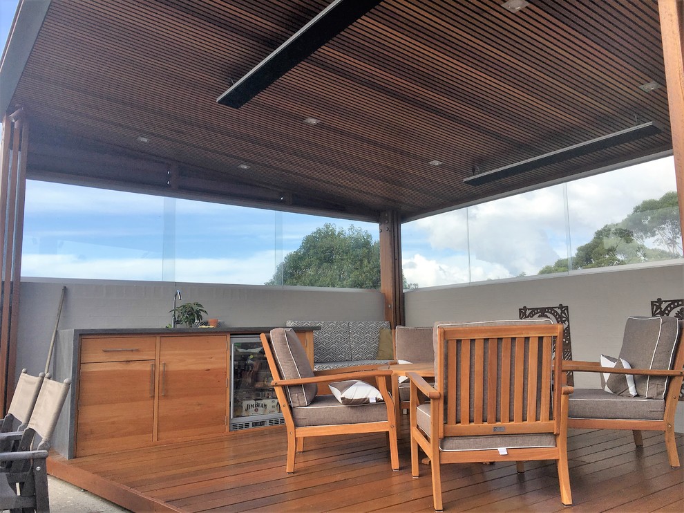 Mid-sized contemporary balcony in Wollongong with a pergola.