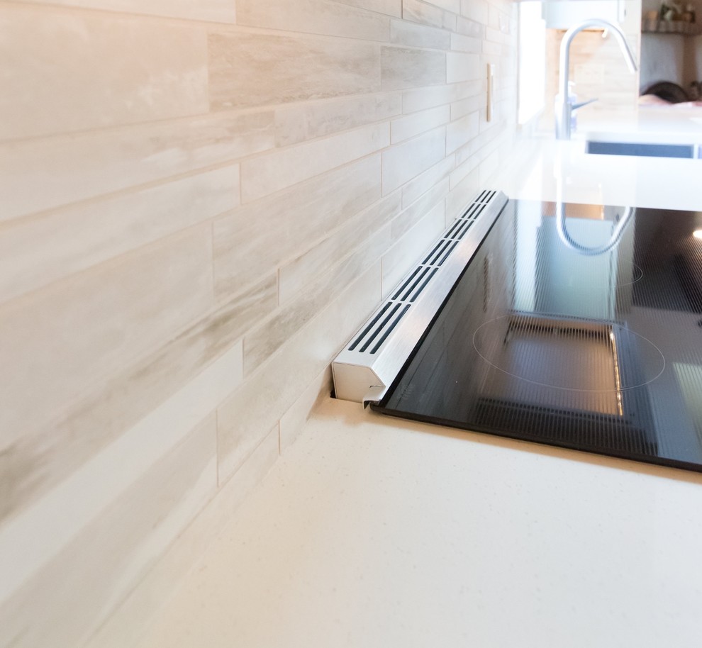 Kitchen - mid-sized transitional u-shaped porcelain tile kitchen idea in Phoenix with a farmhouse sink, shaker cabinets, gray cabinets, quartz countertops, gray backsplash, porcelain backsplash, stainless steel appliances and a peninsula