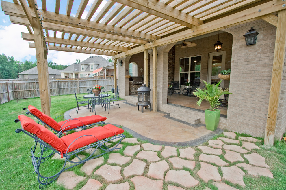 Inspiration for a traditional patio in Little Rock with a pergola.