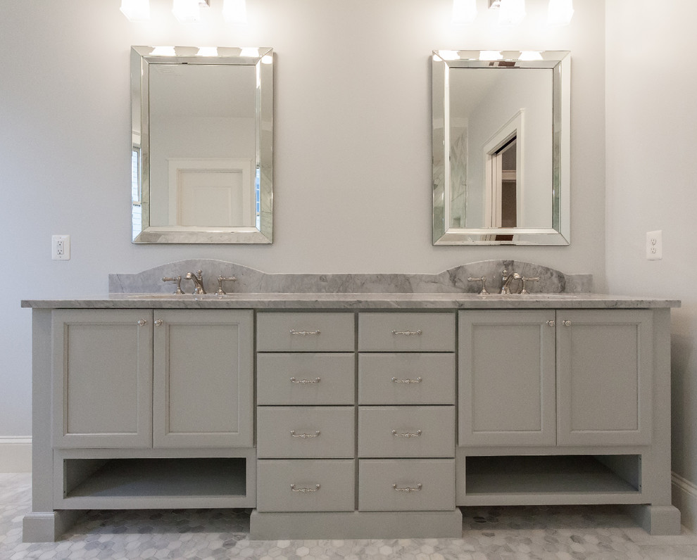 Inspiration for a mid-sized contemporary master bathroom in DC Metro with shaker cabinets, blue cabinets, a freestanding tub, an open shower, a one-piece toilet, white walls, linoleum floors, an undermount sink, granite benchtops, grey floor, a sliding shower screen and grey benchtops.