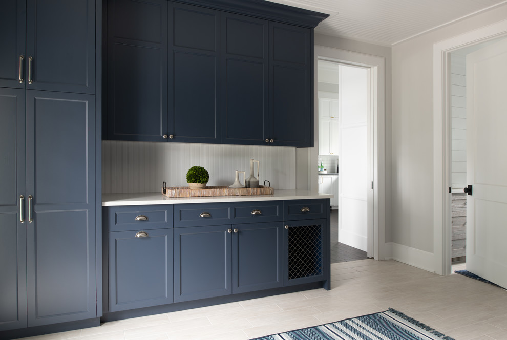 Inspiration for a mid-sized transitional kitchen in Minneapolis with recessed-panel cabinets, blue cabinets, quartz benchtops, white splashback, timber splashback, porcelain floors, beige floor and white benchtop.