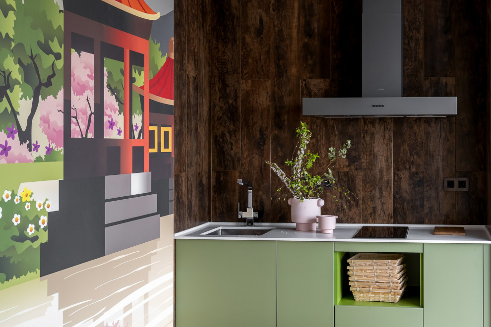 Inspiration for a medium sized world-inspired single-wall kitchen/diner in Other with a submerged sink, flat-panel cabinets, green cabinets, engineered stone countertops, brown splashback, matchstick tiled splashback, black appliances, vinyl flooring, no island, brown floors, white worktops and exposed beams.