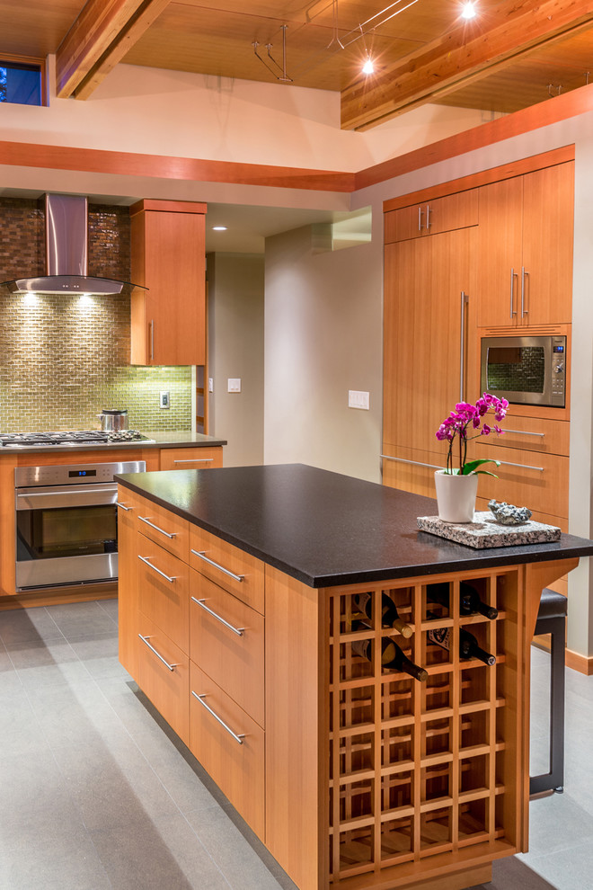 This is an example of a mid-sized contemporary l-shaped separate kitchen in Other with flat-panel cabinets, medium wood cabinets, green splashback, panelled appliances, with island, an undermount sink, quartz benchtops, glass tile splashback and porcelain floors.