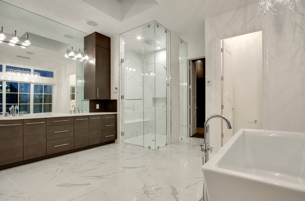 Large contemporary master bathroom in Calgary with an undermount sink, flat-panel cabinets, dark wood cabinets, quartzite benchtops, a freestanding tub, an open shower, a one-piece toilet, white tile, ceramic tile, white walls and marble floors.
