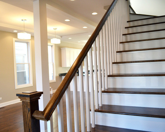 Inspiration for a large traditional wood straight staircase in Chicago with wood risers.