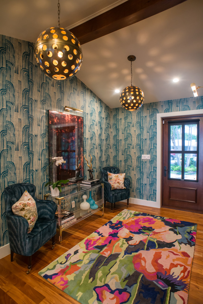 Example of a mid-sized eclectic medium tone wood floor front door design in Miami with multicolored walls and a dark wood front door