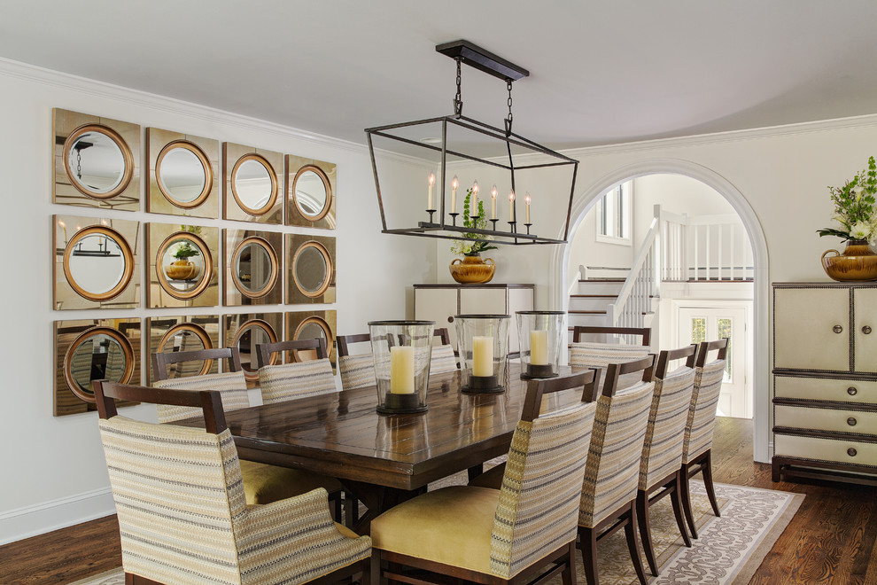 Inspiration for a traditional separate dining room in New York with white walls, medium hardwood floors, brown floor and no fireplace.