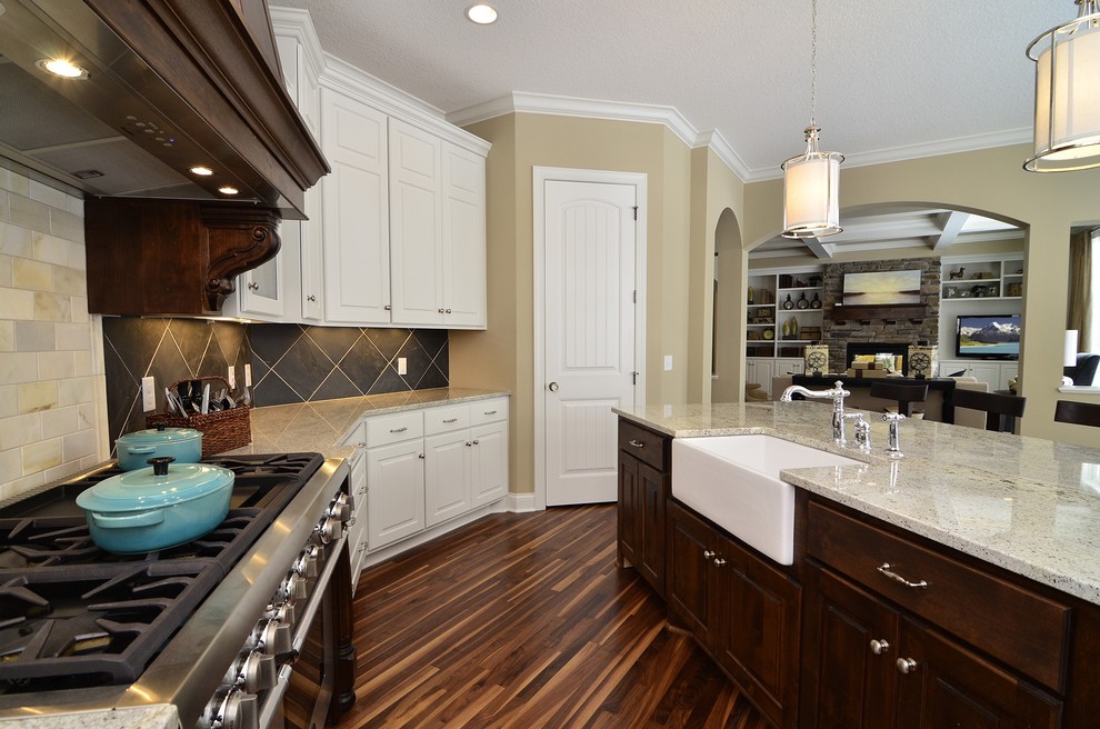 Photo of a traditional kitchen in Minneapolis with a farmhouse sink and granite benchtops.