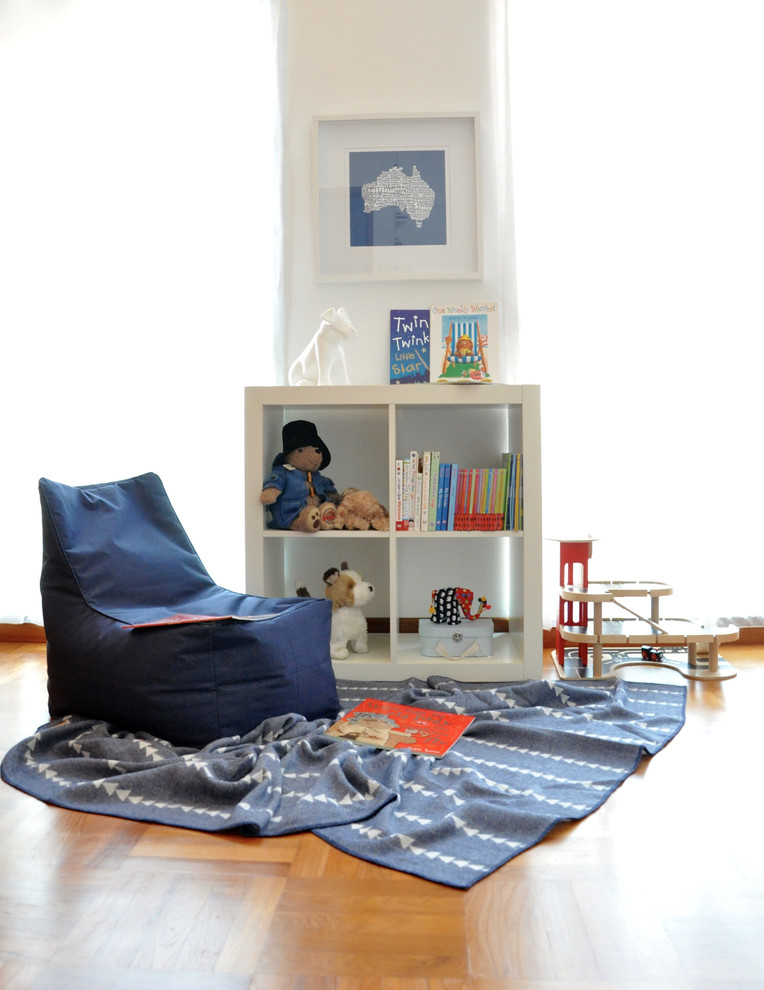 Photo of a contemporary kids' room in Other with medium hardwood floors.