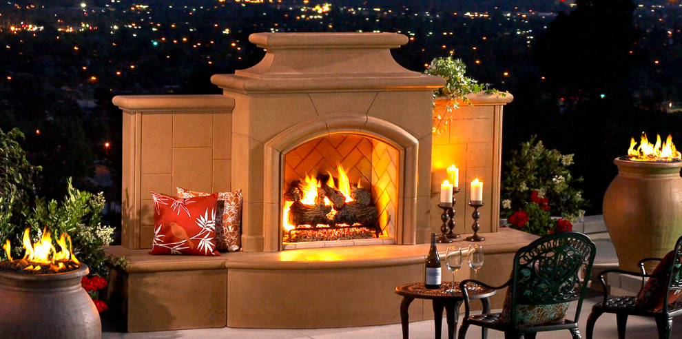 Photo of a mid-sized traditional backyard patio in Orange County with a fire feature, tile and no cover.