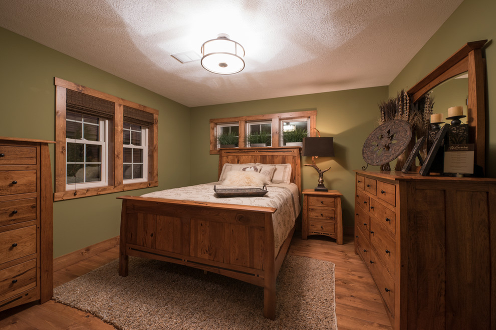 This is an example of a country bedroom in Cleveland.
