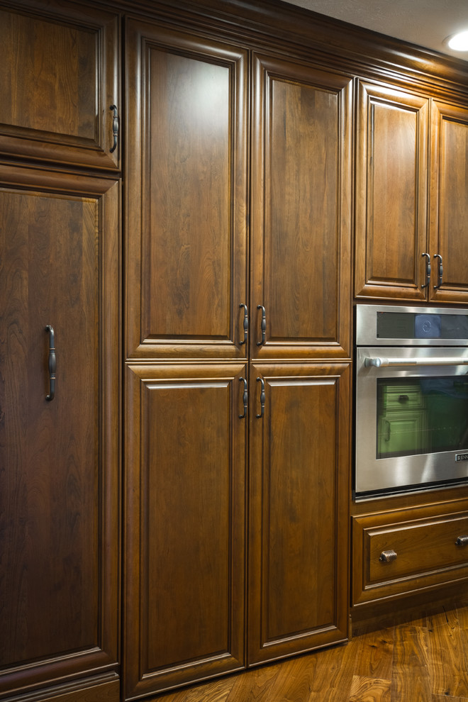 Large transitional l-shaped eat-in kitchen photo with two islands