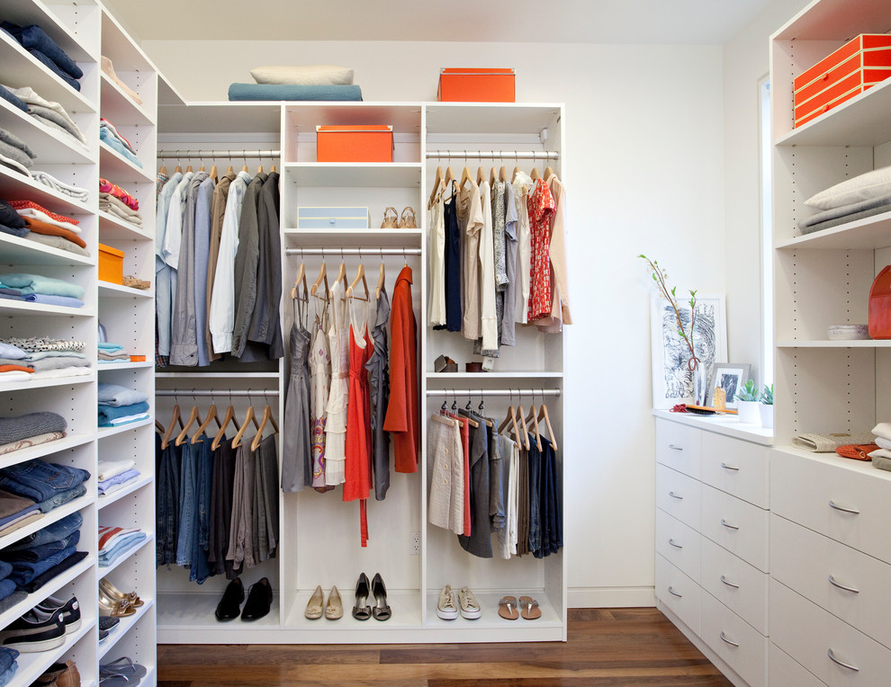 Inspiration for a large contemporary gender-neutral walk-in wardrobe in Hawaii with white cabinets.