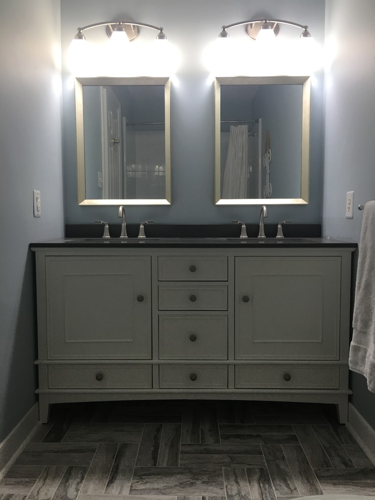 Mid-sized minimalist 3/4 porcelain tile and gray floor bathroom photo in Richmond with raised-panel cabinets, white cabinets, blue walls, an undermount sink and quartz countertops