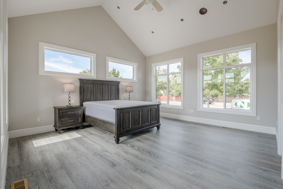 Design ideas for a mid-sized contemporary master bedroom in Other with beige walls, vinyl floors, no fireplace and grey floor.
