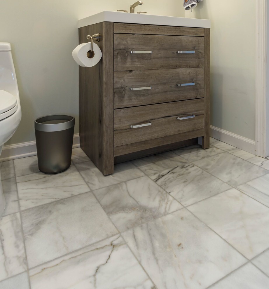 Inspiration for a small traditional 3/4 bathroom in DC Metro with flat-panel cabinets, dark wood cabinets, an alcove tub, an alcove shower, a two-piece toilet, blue walls, marble floors and engineered quartz benchtops.