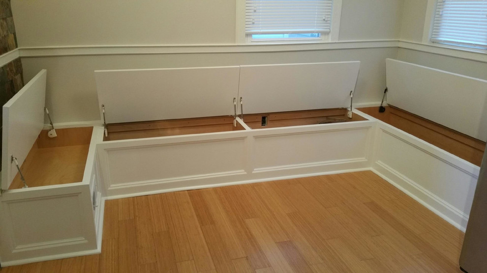 Photo of a mid-sized transitional hallway in New York with white walls and light hardwood floors.