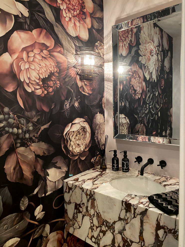 Inspiration for a small contemporary cloakroom in San Francisco with a one-piece toilet, white walls, vinyl flooring, a submerged sink, marble worktops, brown floors, multi-coloured worktops, a floating vanity unit and wallpapered walls.