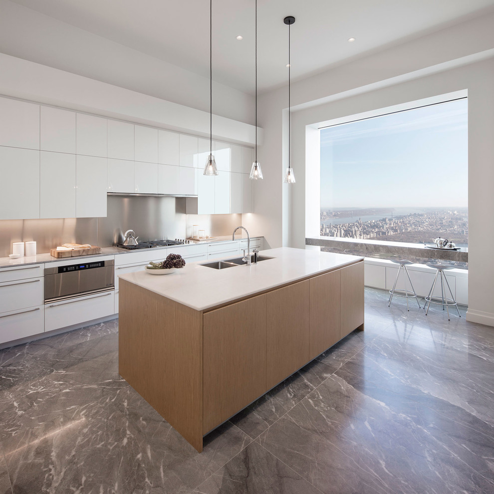 Photo of an expansive contemporary single-wall open plan kitchen in Florence with a double-bowl sink, flat-panel cabinets, white cabinets, metallic splashback, with island, stainless steel appliances and marble floors.