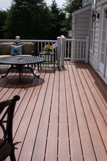 This is an example of an expansive tropical backyard deck in DC Metro with no cover.