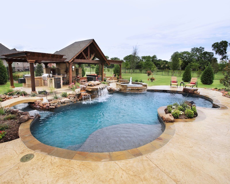 Photo of a tropical pool in Dallas.