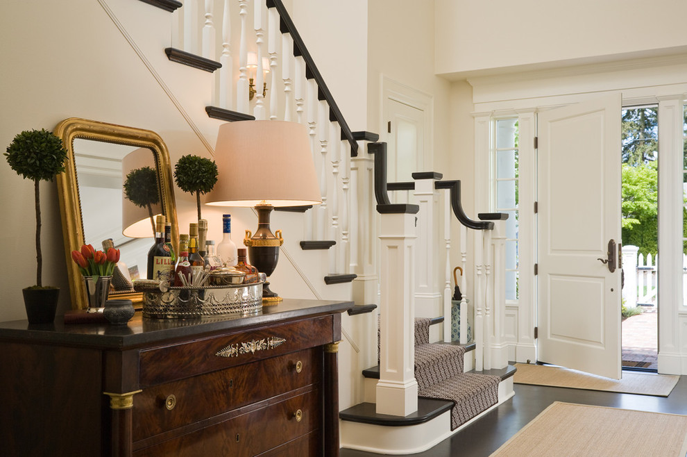 Traditional foyer in Seattle with black floor.