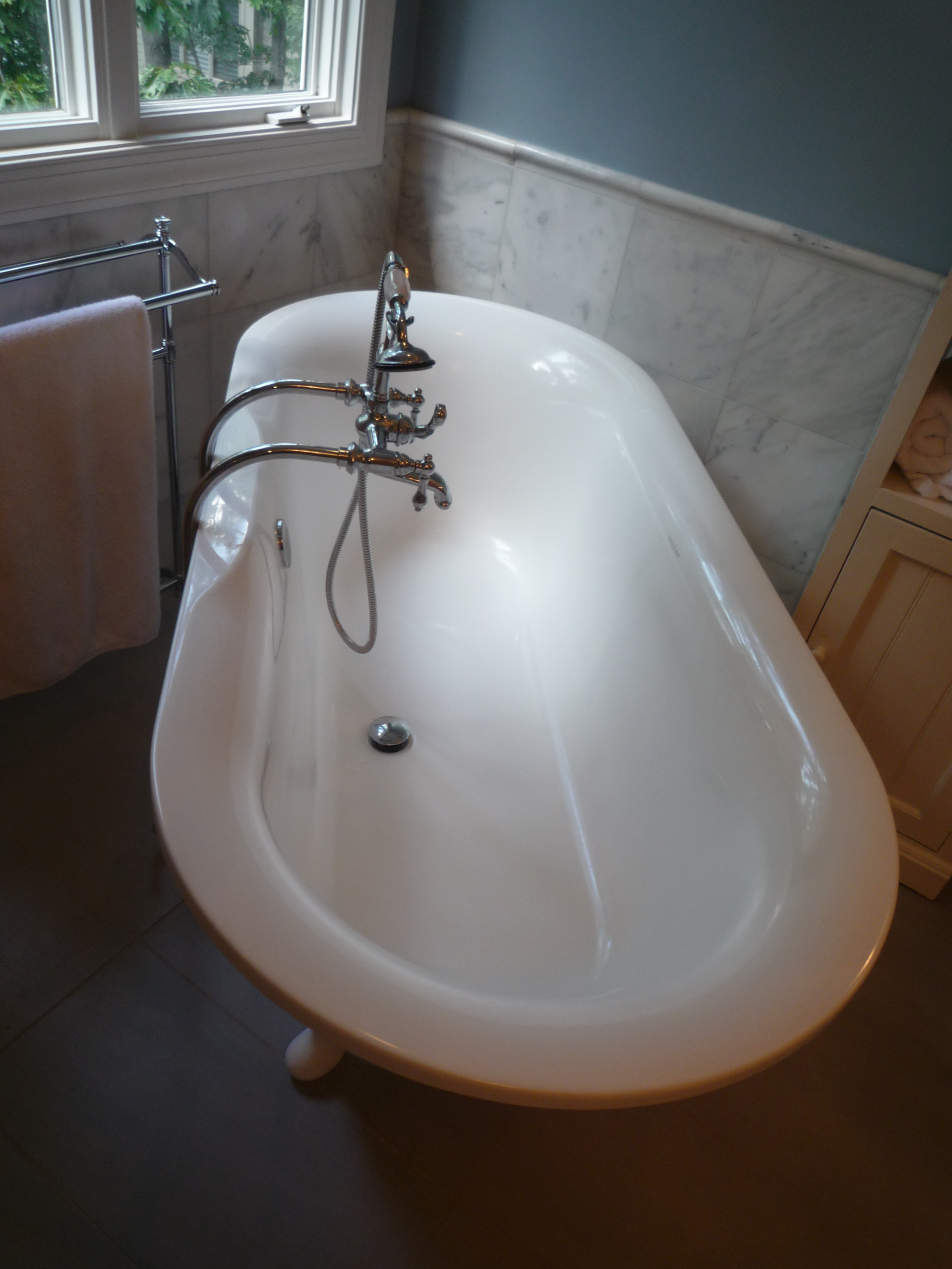 White Marble Blue walls bath in McLean