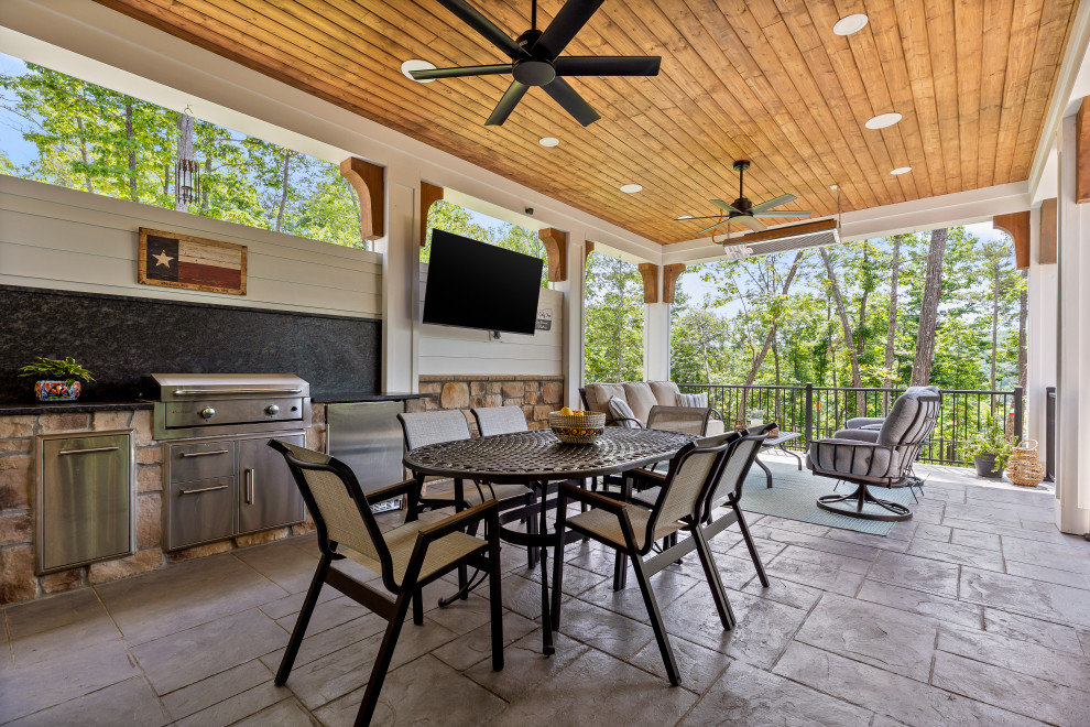 Mid-sized cottage patio photo with a bbq area and a roof extension