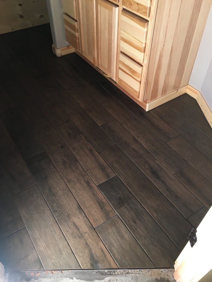 Inspiration for a mid-sized rustic master brown tile and porcelain tile porcelain tile home design remodel