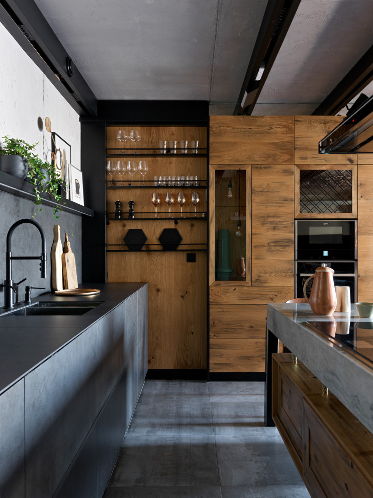 Design ideas for a mid-sized industrial l-shaped open plan kitchen in Moscow with a double-bowl sink, flat-panel cabinets, black cabinets, quartz benchtops, black splashback, engineered quartz splashback, panelled appliances, with island, black benchtop, exposed beam, medium hardwood floors and brown floor.