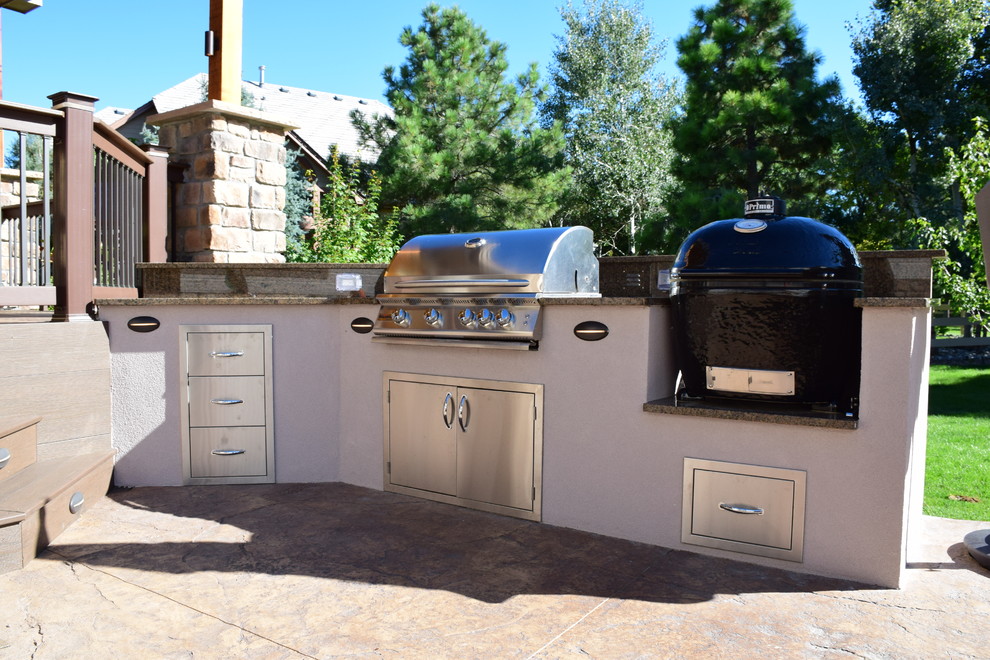 Outdoor kitchen deck - mid-sized transitional backyard outdoor kitchen deck idea in Denver with a roof extension