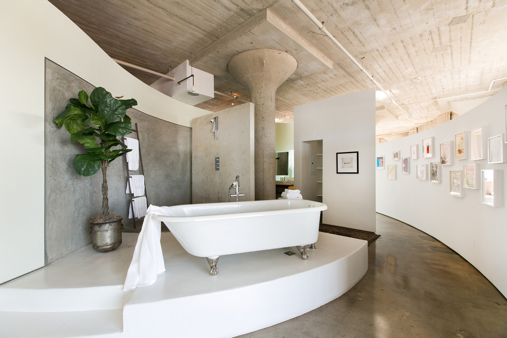 Inspiration for an industrial concrete floor and gray floor bathroom remodel in Los Angeles with white walls