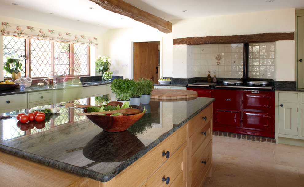 Inspiration for an expansive country open plan kitchen in Surrey with shaker cabinets, green cabinets, granite benchtops and with island.