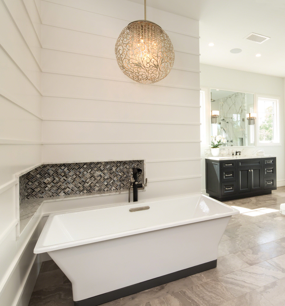 Photo of an expansive traditional master bathroom in Los Angeles with recessed-panel cabinets, dark wood cabinets, a freestanding tub, an open shower, white walls, marble floors, an undermount sink, engineered quartz benchtops, multi-coloured floor and a hinged shower door.