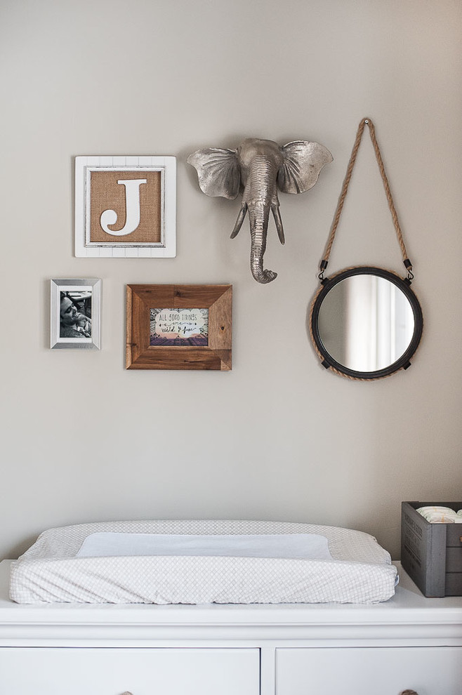Inspiration for a mid-sized transitional gender-neutral dark wood floor nursery remodel in Toronto with gray walls