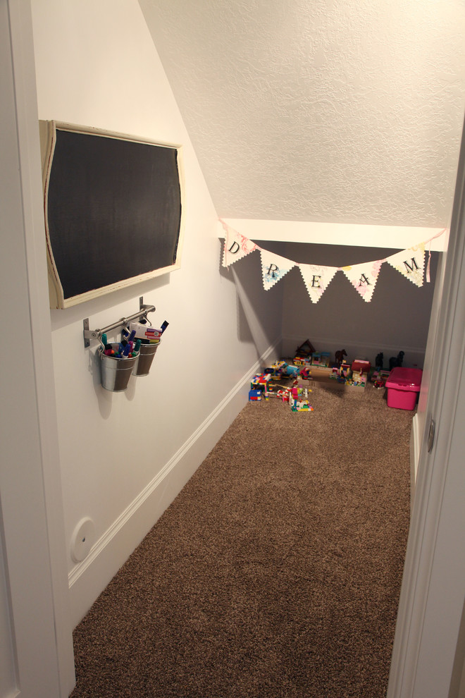Mid-sized traditional gender-neutral kids' playroom in Salt Lake City with white walls and carpet for kids 4-10 years old.