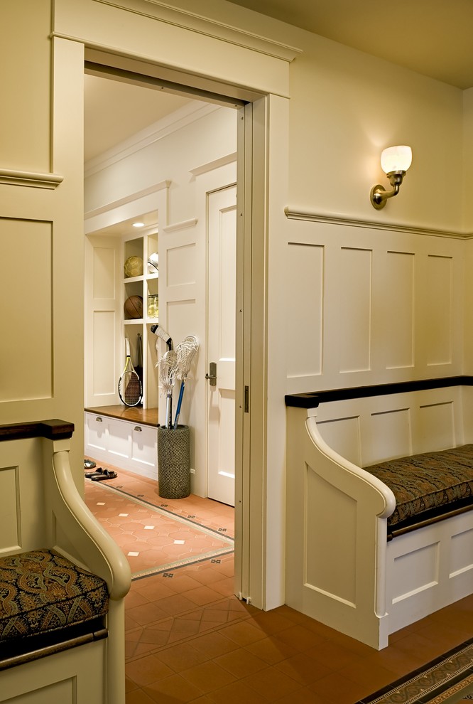 Photo of a traditional mudroom in Burlington with beige walls.