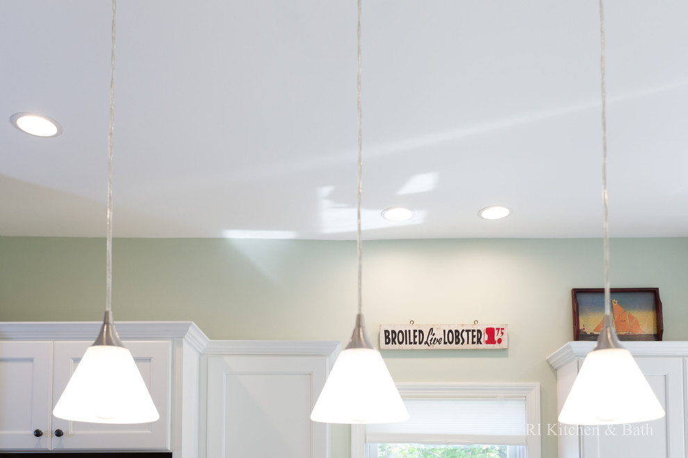 Example of a large transitional l-shaped porcelain tile eat-in kitchen design in Providence with an undermount sink, recessed-panel cabinets, white cabinets, granite countertops, gray backsplash, ceramic backsplash, stainless steel appliances, green walls and an island