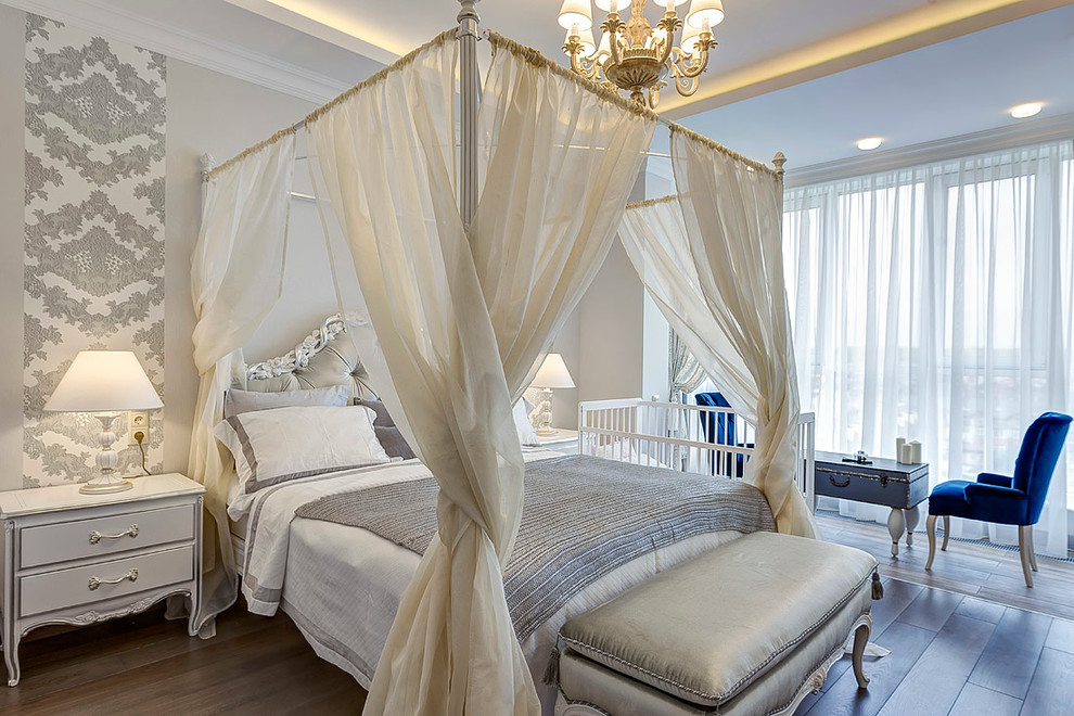 This is an example of a traditional master bedroom in Moscow with grey walls, no fireplace and dark hardwood floors.