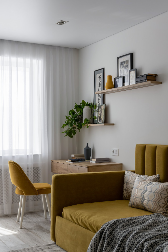 Esempio di una camera degli ospiti contemporanea di medie dimensioni con pareti bianche, pavimento in vinile, pavimento grigio e angolo studio