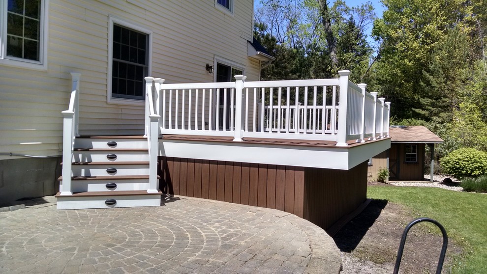 Mid-sized traditional backyard deck in Cleveland with no cover.