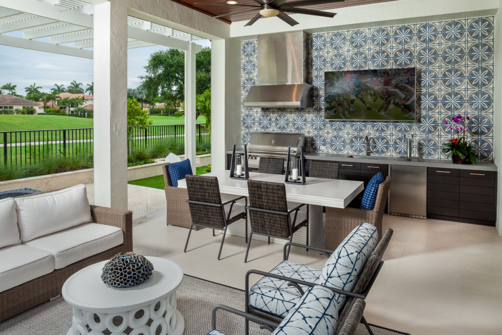 Transitional patio in Miami with an outdoor kitchen.