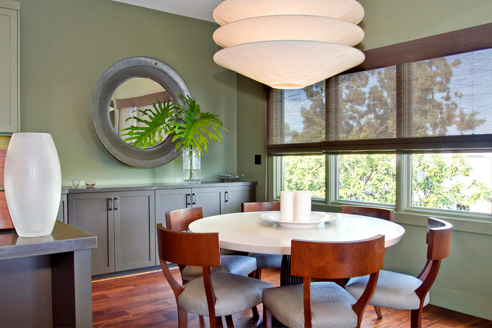 Inspiration for a large contemporary separate dining room in San Diego with green walls, dark hardwood floors, no fireplace and brown floor.