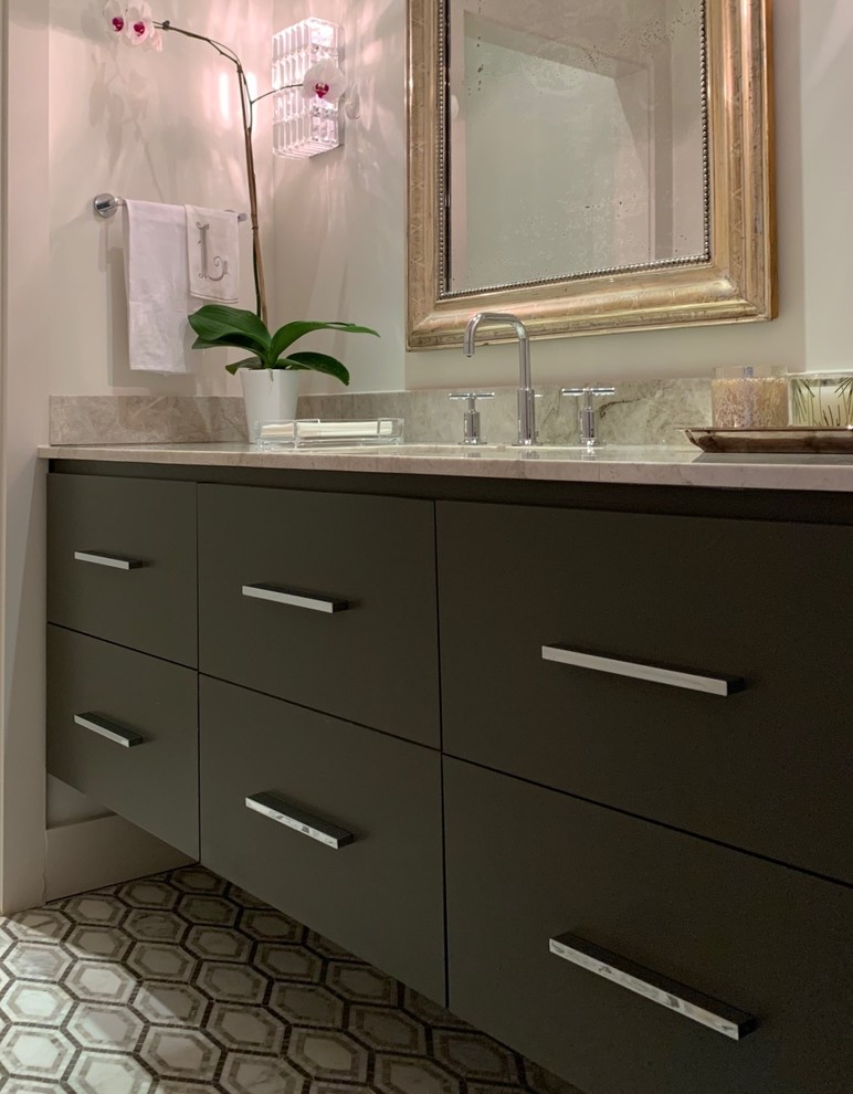 Photo of a mid-sized modern powder room in Houston with flat-panel cabinets, an undermount sink, quartzite benchtops, grey floor, white benchtops, medium wood cabinets, a one-piece toilet, white walls, mosaic tile floors and a floating vanity.