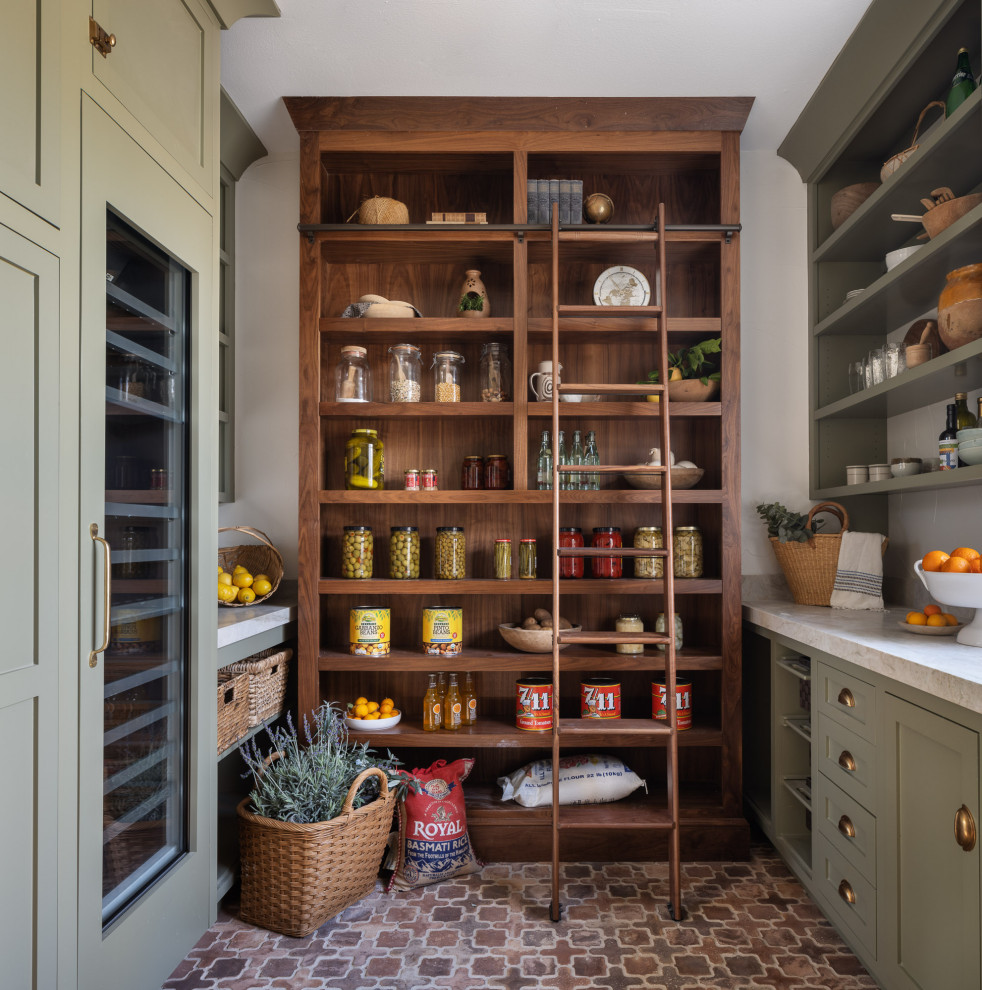 This is an example of an u-shaped kitchen pantry in Los Angeles with shaker cabinets, green cabinets, grey splashback, stone slab splashback, integrated appliances, no island, red floors and grey worktops.