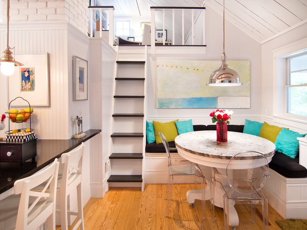 Design ideas for a beach style kitchen/dining combo in Portland Maine with grey walls and medium hardwood floors.