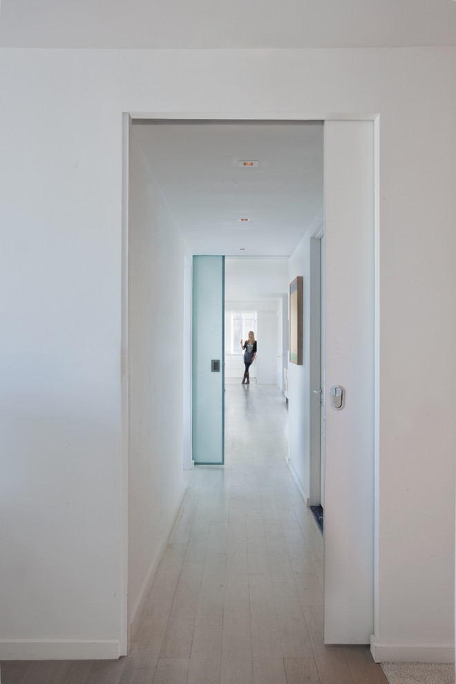 Modern hallway in New York with white walls.
