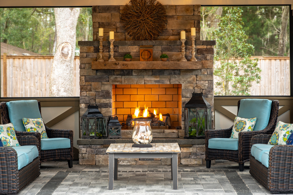Design ideas for a mid-sized country patio in Jacksonville with with fireplace.