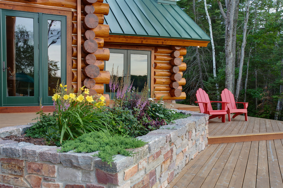 Deck - large rustic backyard deck idea with no cover
