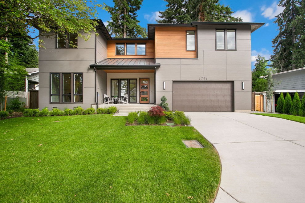 Design ideas for a large contemporary two-storey concrete grey house exterior in Seattle with a gable roof, a mixed roof, a black roof and board and batten siding.